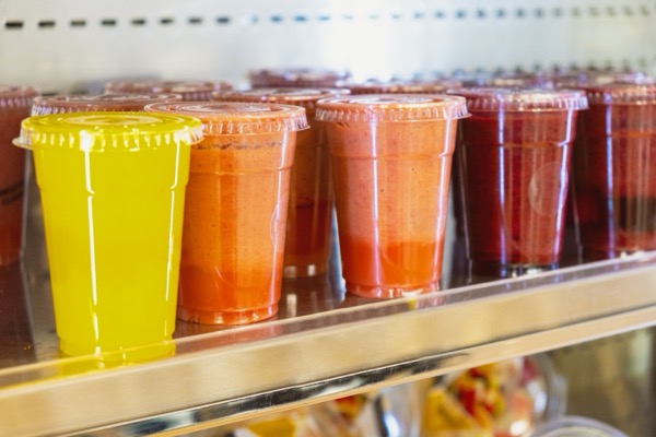 Bottled collagen beverages stored in a refrigerator